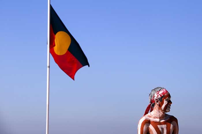 A traditionally dressed Australian Aboriginal performer participates in a Corroborree showcasing traditional dance during National Reconciliation Week on Coogee Beach, Sydney. Source: Reuters 