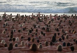 People stand naked as part of artist Spencer Tunick's art installation to raise awareness of skin cancer and encourage people to have their skin checked, at Bondi Beach in Sydney, Australia, November 26, 2022.  REUTERS/Loren Elliott  EDITORIAL USE ONLY.