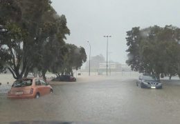 FILE PHOTO: Cars are seen in a flooded street during heavy rainfall in Auckland, New Zealand January 27, 2023, in this screen grab obtained from a social media video. @MonteChristoNZ/via REUTERS//File Photo