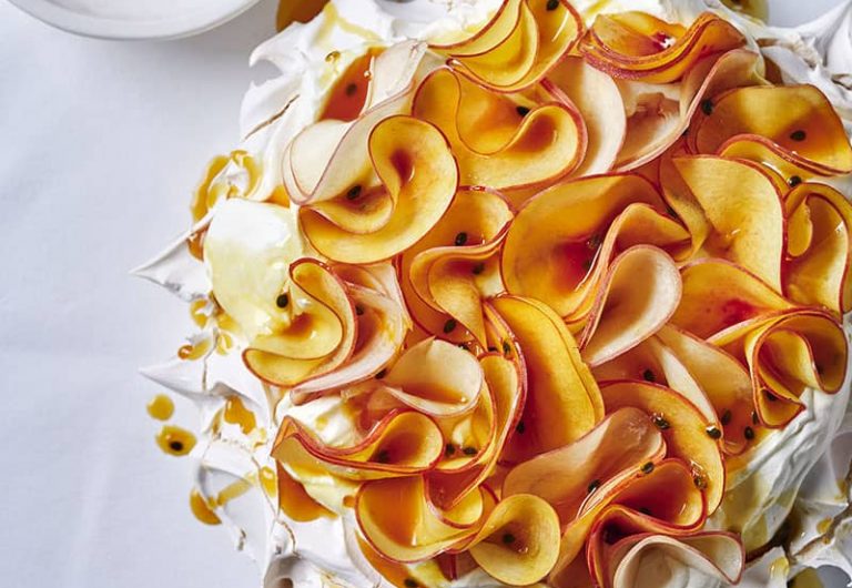 Coconut pavlova with passionfruit caramel and peaches