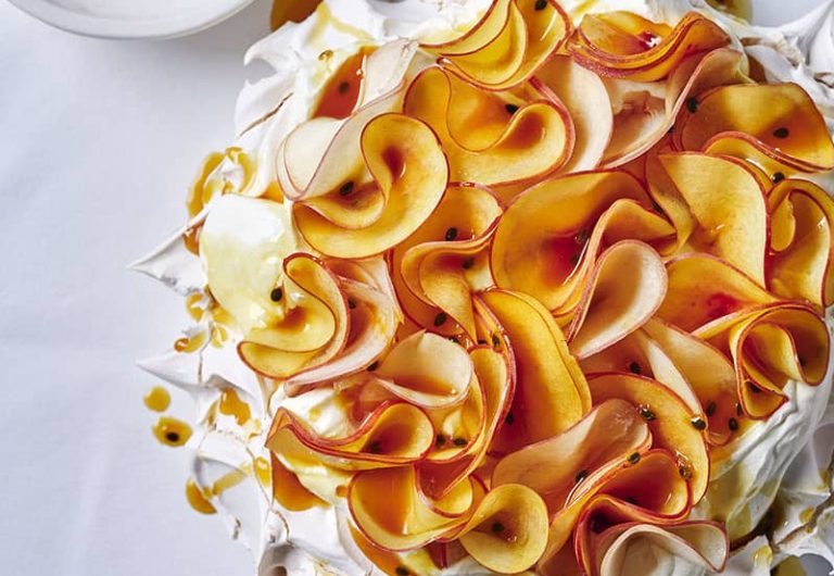 Coconut pavlova with passionfruit caramel and peaches