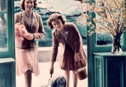 Princesses Elizabeth and Margaret plus canine friend outside the Royal Lodge, Windsor, in 1942