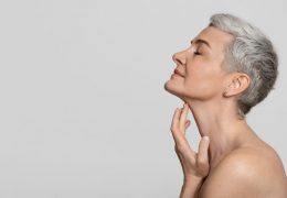Anti-age,Treatment.,Profile,Of,Beautiful,Middle-aged,Woman,Touching,Soft,Skin