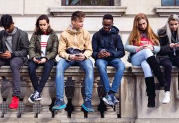 Teenagers students using smartphone on a school break