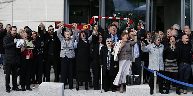 Relatives sing "You'll never walk alone" after the jury delivered its verdict at the new inquests into the Hillsborough disaster. REUTERS/Phil Noble