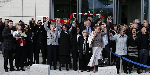 Relatives sing "You'll never walk alone"  after the jury delivered its verdict at the new inquests into the Hillsborough disaster. REUTERS/Phil Noble