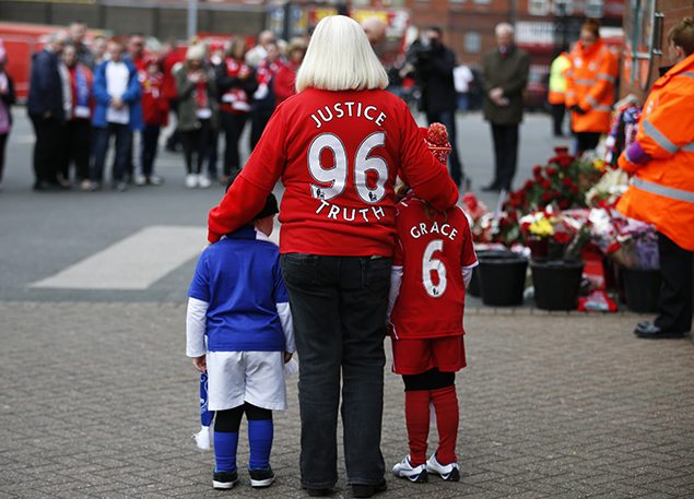 A woman and two children arrive to attend the memorial service for the 96 victims of the Hillsborough disaster at Anfield in Liverpool, Britain April 15, 2016. REUTERS/Phil Noble 