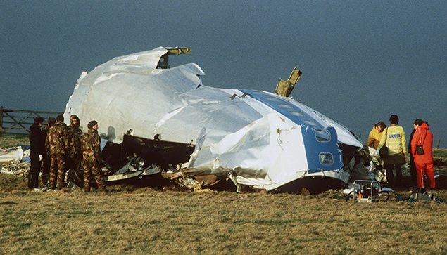 In this December 23, 1988 file photo, Scottish rescue workers and crash investigators search the area around the cockpit of Pan Am flight 103 in a farmer's field east of Lockerbie
Scotland after a mid-air bombing killed all 259 passengers and crew, and 11 people on the ground. REUTERS/Greg Bos
