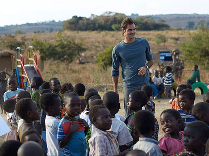 Roger Federer in the playground of one of the pre-schools he has funded