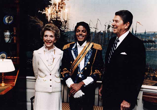 File photo showing former President Ronald Reagan and first lady Nancy Reagan posing with entertainer Michael Jackson in May of 1984.