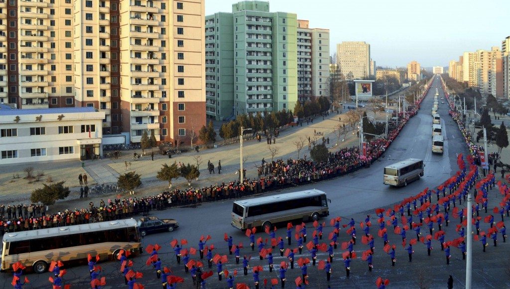 People wave flags as members of operation team of Kwangmyongsong-4 long range rocket arrive at Pyongyang in this undated photo released by North Korea's Korean Central News Agency (KCNA) on February 10, 2016. REUTERS/KCNA ATTENTION EDITORS - THIS PICTURE WAS PROVIDED BY A THIRD PARTY. REUTERS IS UNABLE TO INDEPENDENTLY VERIFY THE AUTHENTICITY, CONTENT, LOCATION OR DATE OF THIS IMAGE. FOR EDITORIAL USE ONLY. NOT FOR SALE FOR MARKETING OR ADVERTISING CAMPAIGNS. THIS PICTURE IS DISTRIBUTED EXACTLY AS RECEIVED BY REUTERS, AS A SERVICE TO CLIENTS. NO THIRD PARTY SALES. SOUTH KOREA OUT. NO COMMERCIAL OR EDITORIAL SALES IN SOUTH KOREA - RTX26C7W
