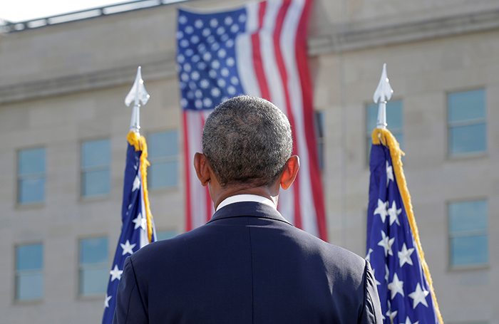 Washington, UNITED STATESPresident Barack Obama faces an American Flag during a ceremony marking the 15th anniversary of the 9/11 attacks at the Pentagon in Washington, U.S., September 11, 2016. REUTERS/Joshua Roberts