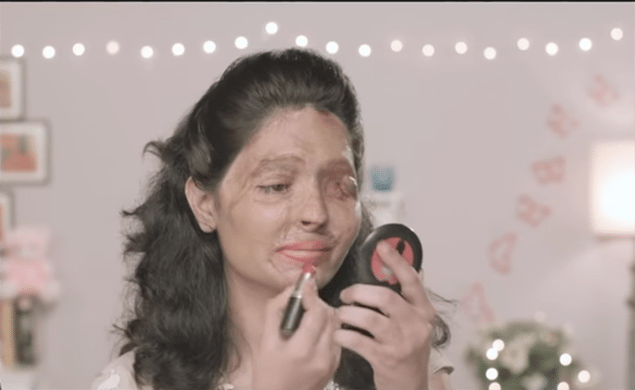 Reshma Bhano, an acid attack victim, shows how to apply "the perfect red lipstick". Make Love Not Scars is trying to stop the sale of concentrated acid in India.