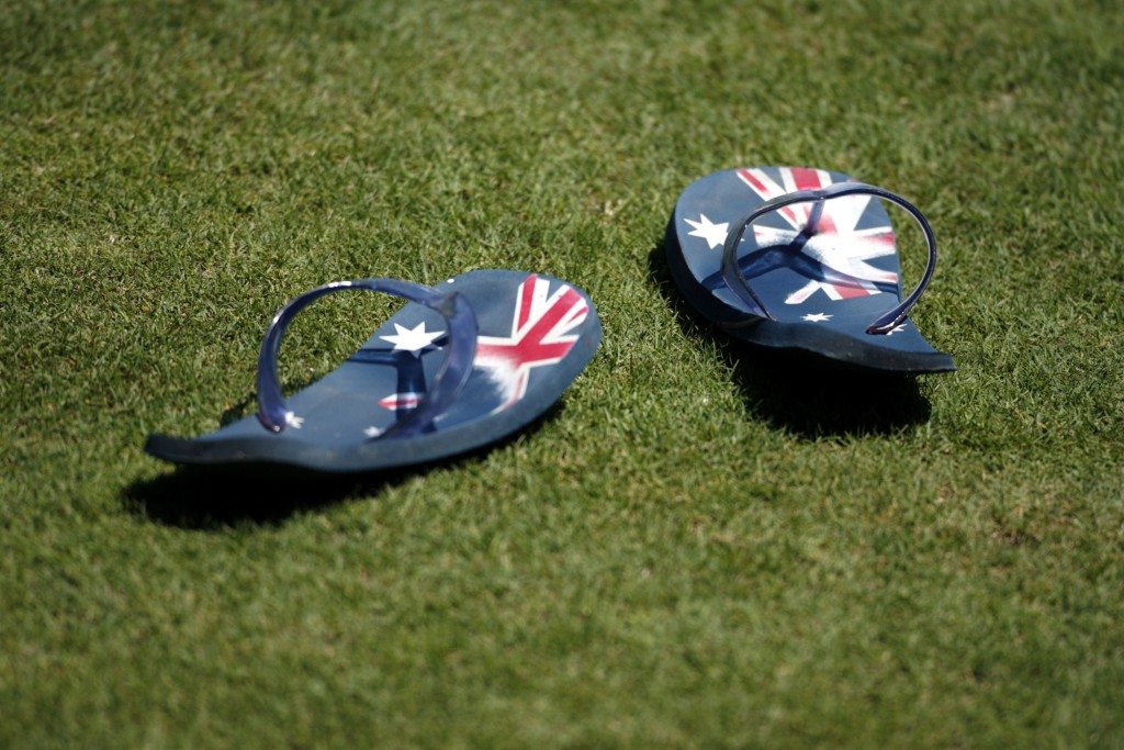 Thongs with Australian flags sit on the field at an Australian team training session during the World Cup cricket tournament on Antigua. REUTERS/Tim Wimborne 