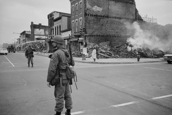 A soldier standing guard at 7th and N Street, N.W., Washington, D.C., with the ruins of buildings that were destroyed during the riots that followed the assassination of Martin Luther King, Jr. REUTERS/Library of Congress