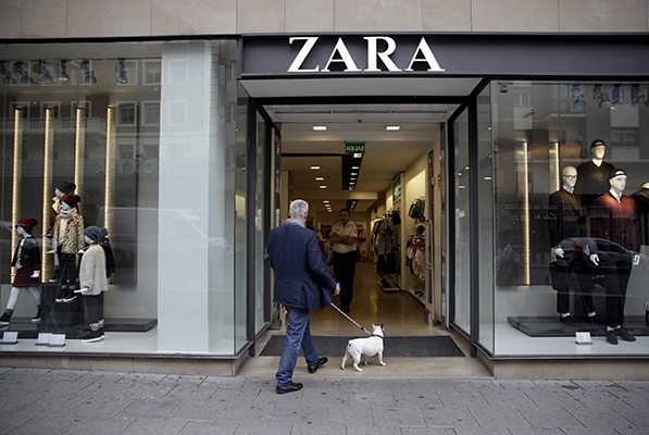 A man approaches a Zara store in central Madrid, Spain. REUTERS/Andrea Comas      