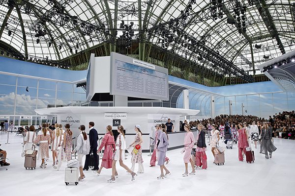 Models present creations by German designer Karl Lagerfeld as part of his Spring/Summer 2016 women's ready-to-wear collection for fashion house Chanel at the Grand Palais which is transformed into a Chanel airport during Fashion Week in Paris, France, October 6, 2015. REUTERS/Benoit Tessier TPX IMAGES OF THE DAY - RTS37GR