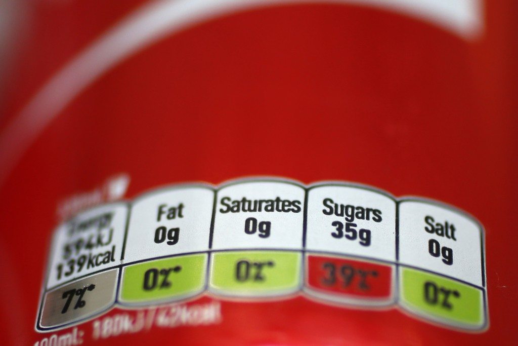 Britain will introduce a sugar levy on soft drinks in two years' time to tackle a growing obesity crisis, finance minister George Osborne said in a surprise announcement on Wednesday, hitting share prices in drinks and sugar firms. REUTERS/Stefan Wermuth