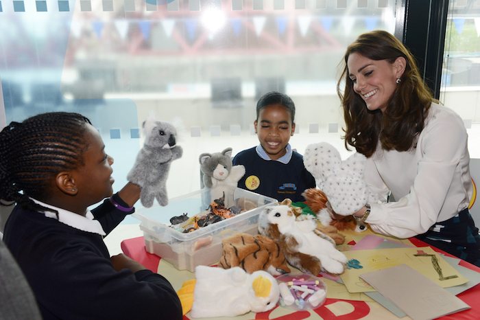 Britain's Kate, the Duchess of Cambridge chats to 9 year old  Eliana Bayan (C) and 10 year old Maggie Fagbohun as she  attend a Heads Together mental health campaign launch in Stratford, East London, May 16, 2016.  REUTERS/Jeremy Selwyn/Pool 