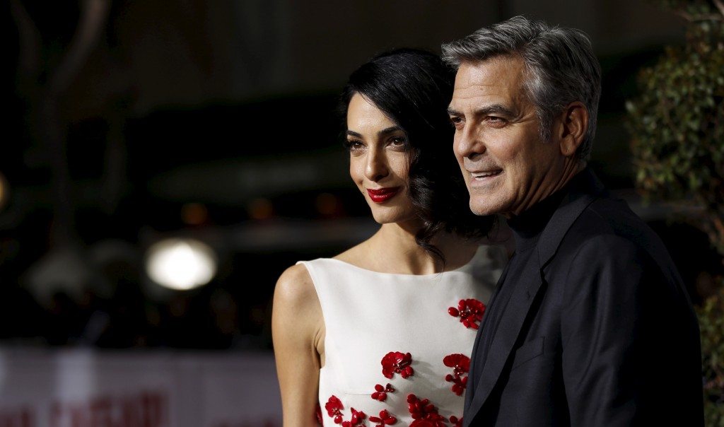 George Clooney and his wife Amal at the premiere of "Hail, Caesar!" in Los Angeles. REUTERS/Mario Anzuoni