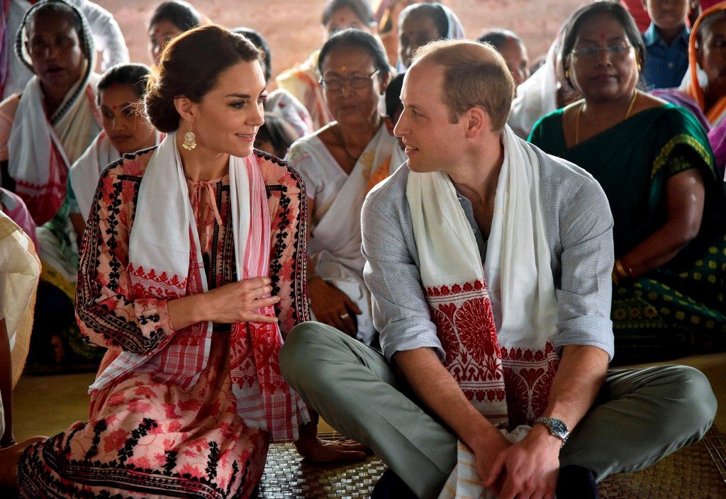 Britain's Prince William and his wife Catherine, the Duchess of Cambridge, visit a "Namghar", an Assamese site of congregational worship, in Panbari village in Kaziranga