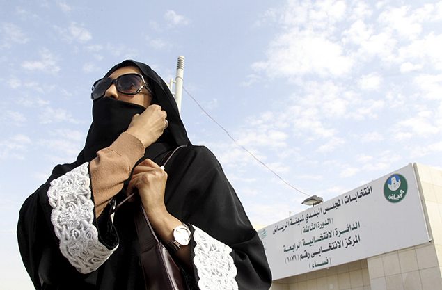 A Saudi woman leaves a polling station after casting her vote during municipal elections.
REUTERS/Faisal Al Nasser