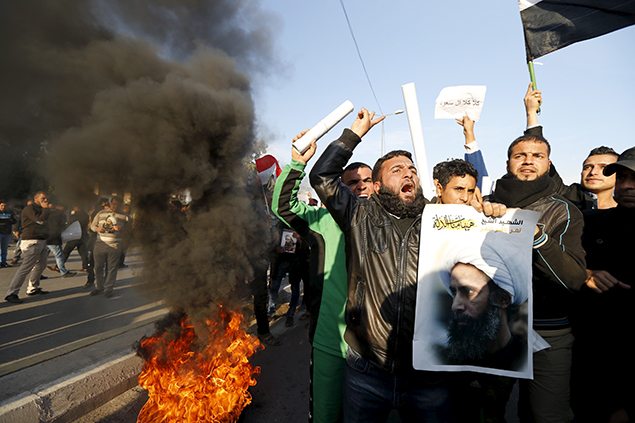 Supporters of Shi'ite cleric Moqtada al-Sadr protest against the execution of Shi'ite Muslim cleric Nimr al-Nimr in Saudi Arabia, during a demonstration in Baghdad. REUTERS
