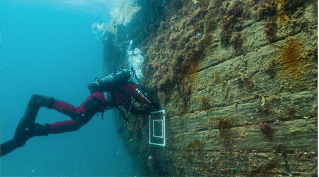 Archaeologists inspects the hull of H.M.S Erebus. PHOTO: PARKS CANADA