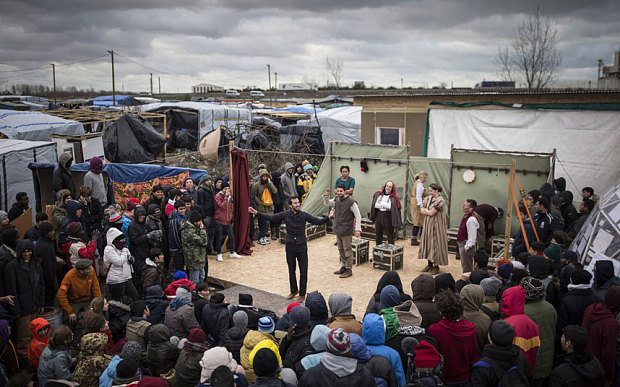 Image: Actors from Shakespeare's Globe perform Hamlet to migrants at the Good Chance Theatre Tent in the Jungle Refugee Camp in Calais, France. Photo: Getty