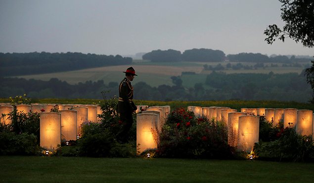 Major General Peter Kelly, Chief of the New Zealand Army, walks amongst the graves ahead of a vigil for the 100th anniversary of the Battle of the Somme in Thiepval, northern France. REUTERS/Phil Noble 