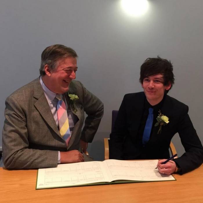 Stephen Fry with Elliott Spencer on their wedding day. 