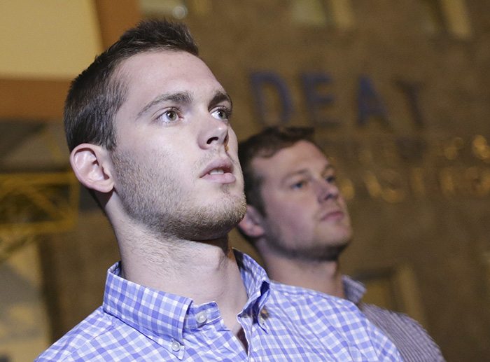 US Olympic swimmers Jack Conger (left) and Gunnar Bentz leave the police station after being questioned. Photo Reuters
