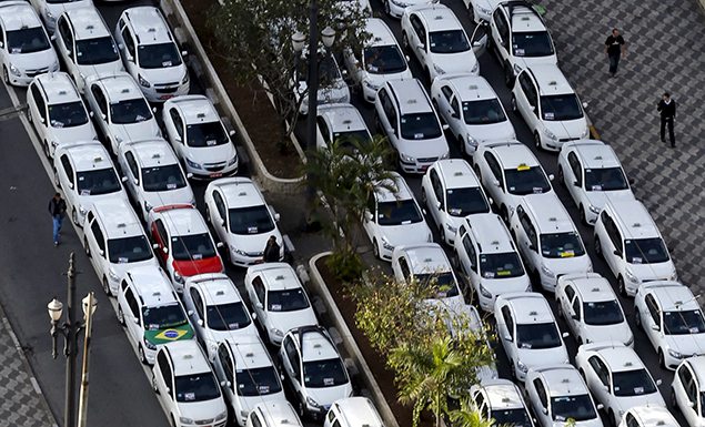 Taxis are seen parked on the street during a protest against the online car-sharing service Uber  in downtown Sao Paulo, Brazil.
REUTERS/Paulo Whitaker 